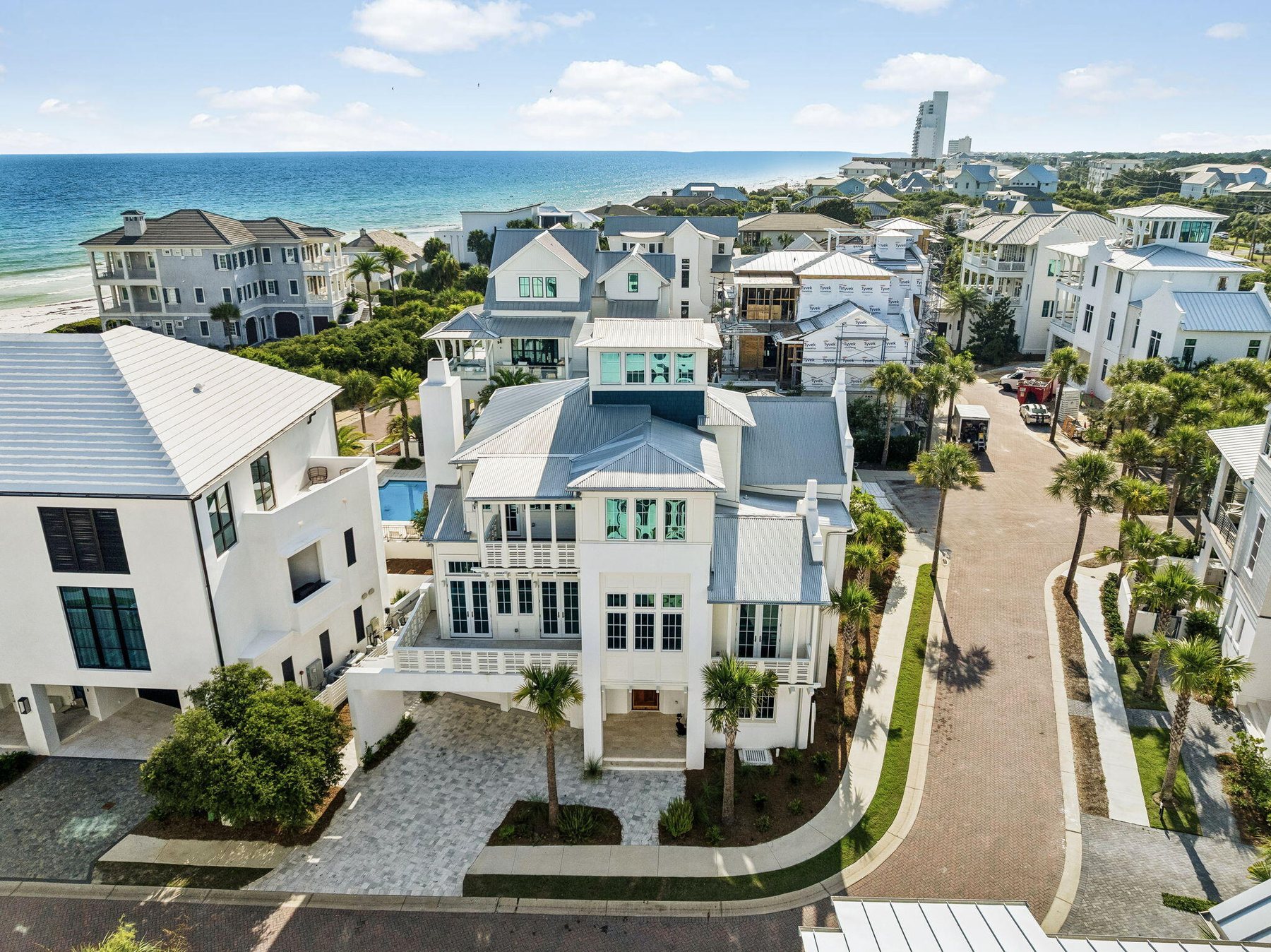 An aerial view of a coastal neighborhood on 30A with the Gulf beyond